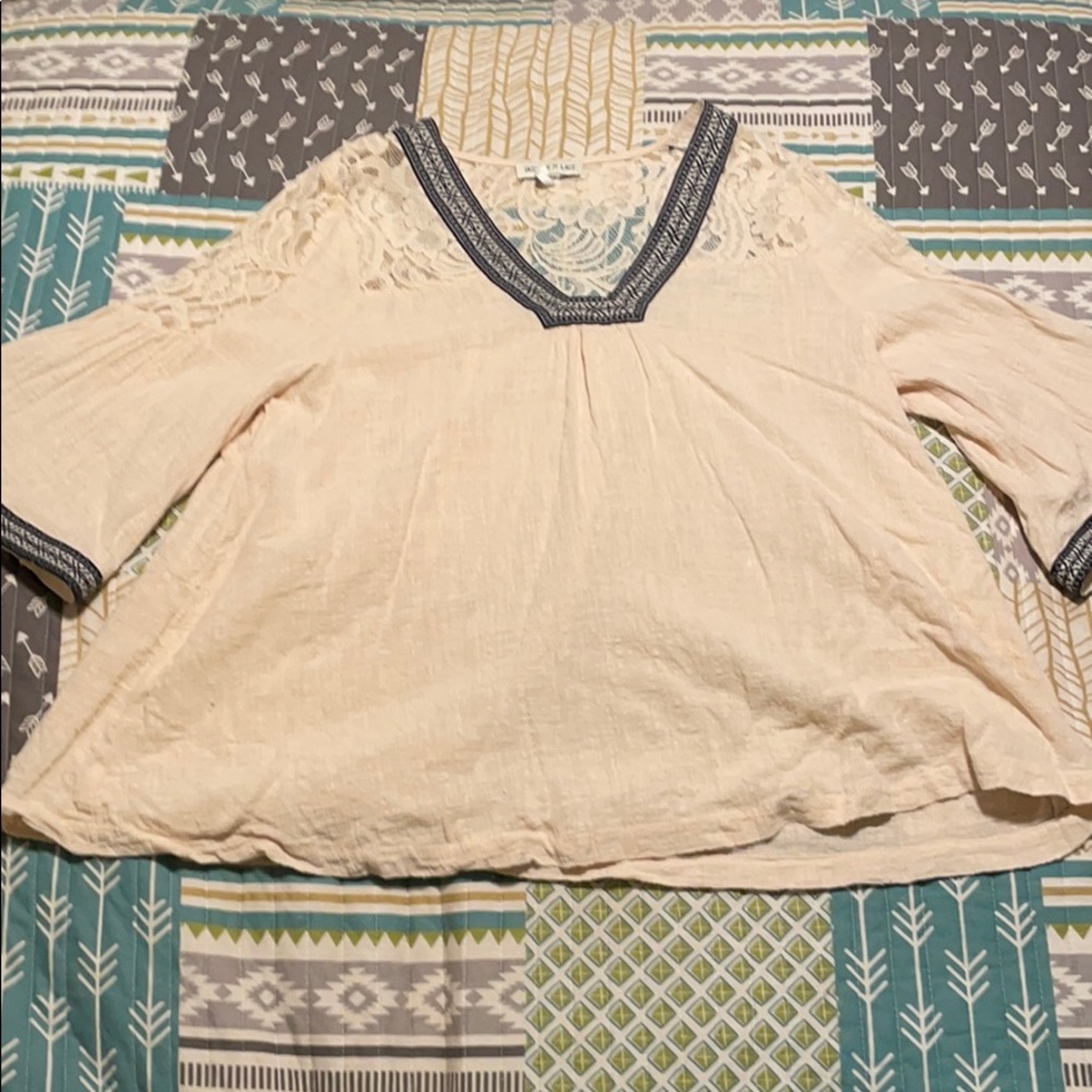 Tassels and lace blouse.